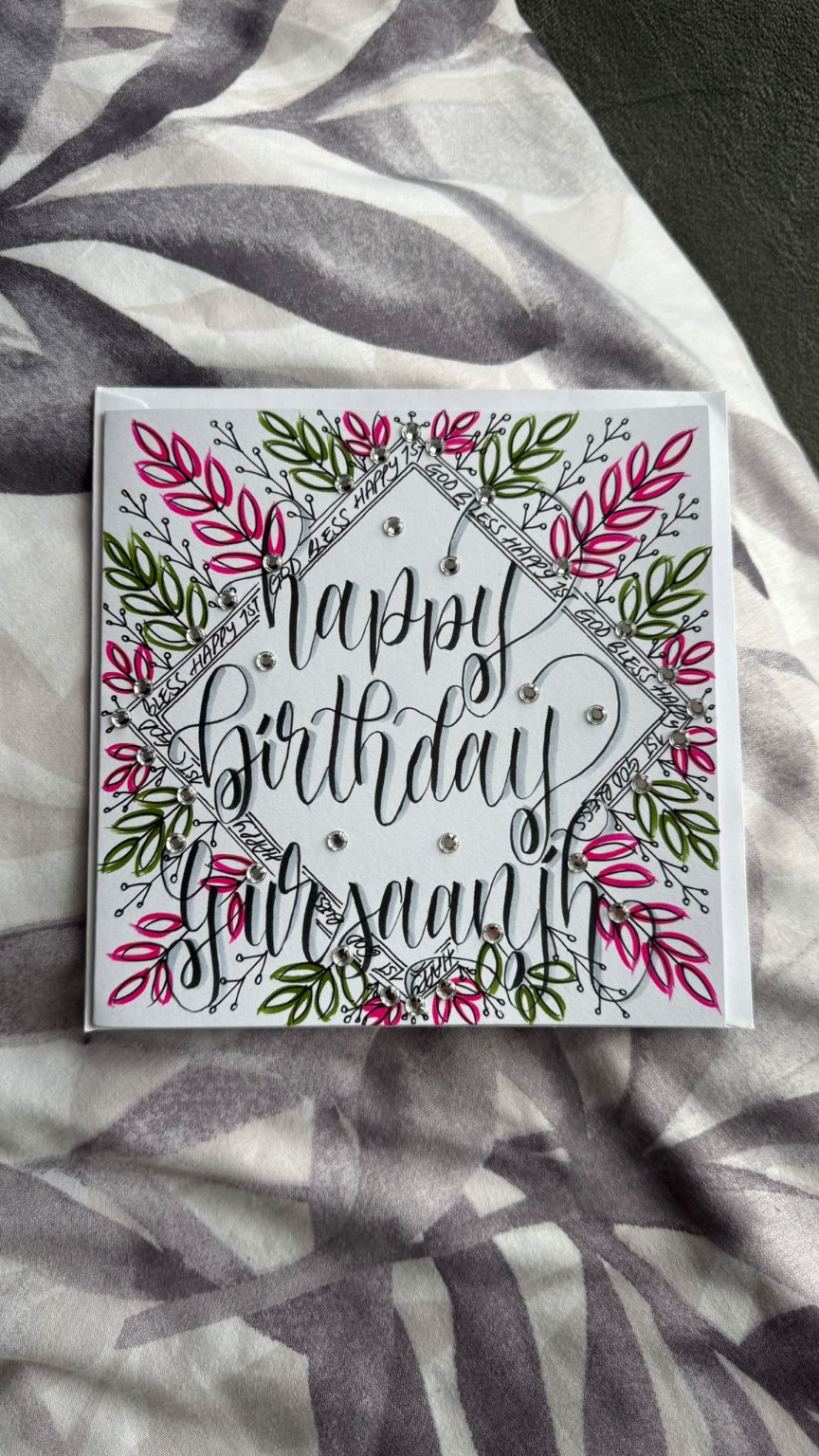 Hand-lettered personalised birthday card with pink and green botanical details.